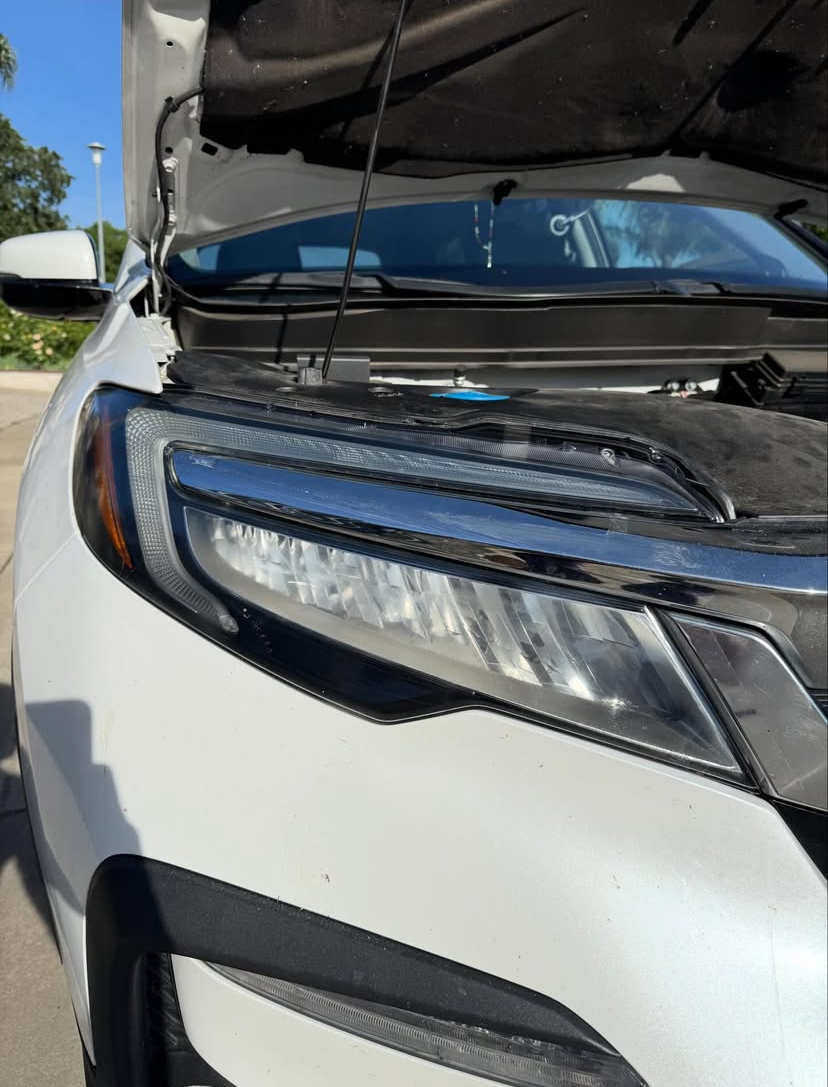 White Honda Pilot — headlight after restoration, crystal clear